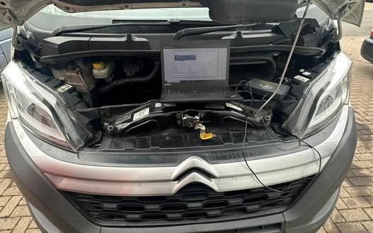 Mobile remap on a Citroën van, laptop connected under the bonnet